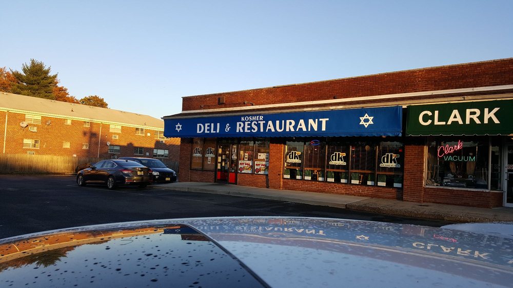 An image of the exterior of Deli King of Clark. It continues to operate from its original location, a suburban strip mall where it opened in 1985