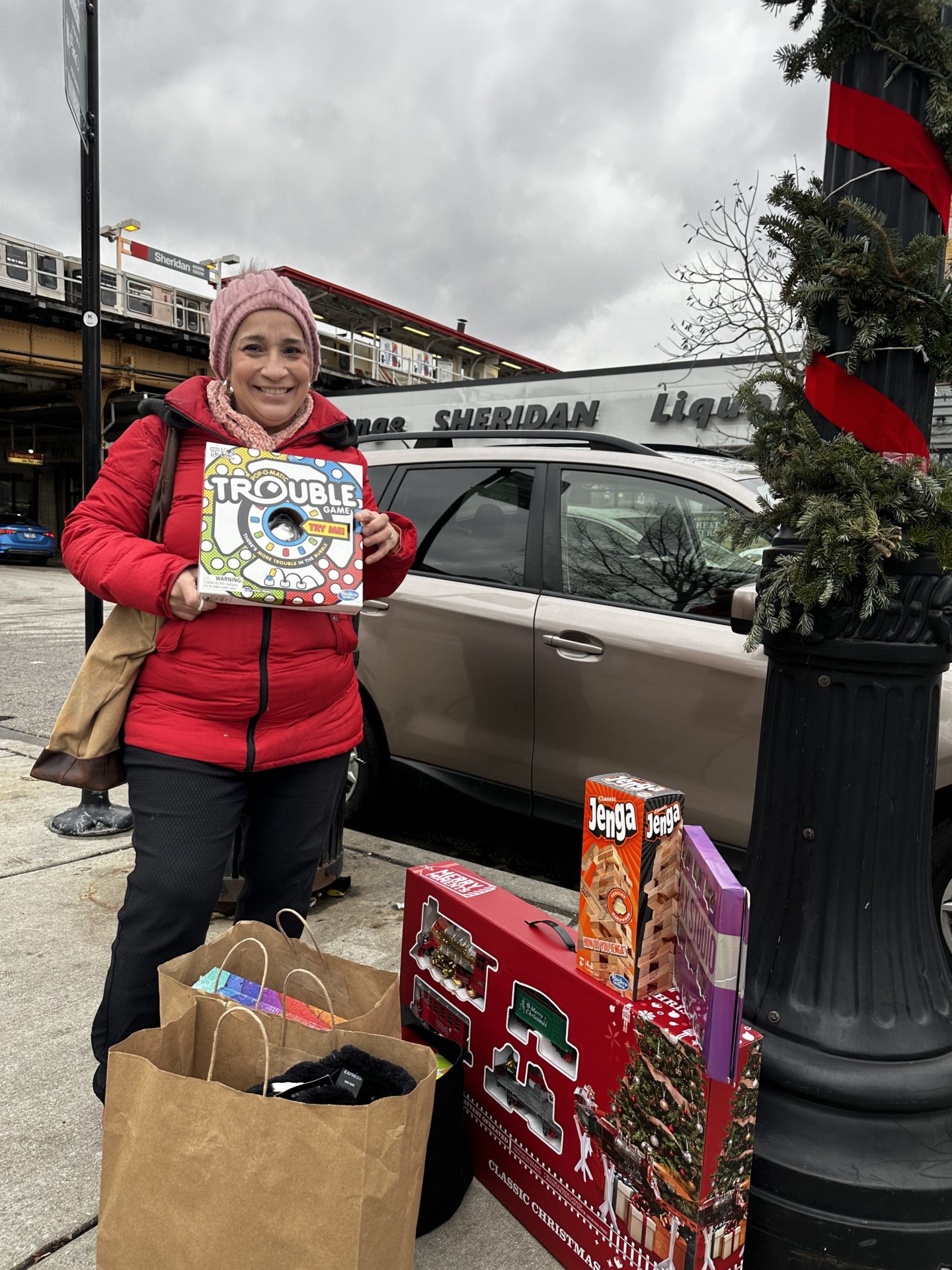 Martha Gomez picks up toys for her four grandchildren at the toy drive. 